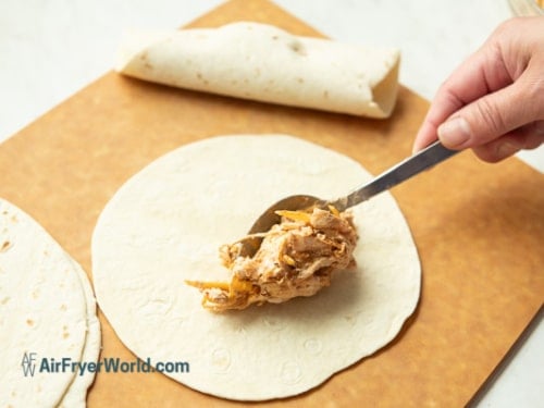 adding filling to tortilla