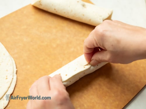 skewer toothpick into flautas