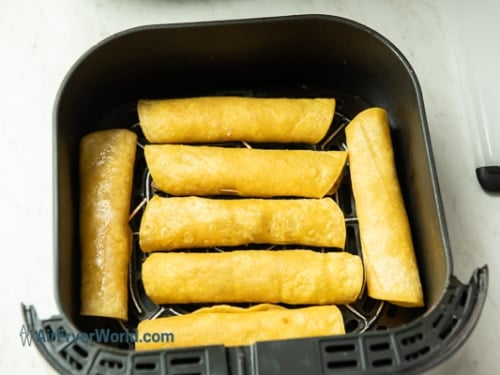 rolled chicken taquitos in basket