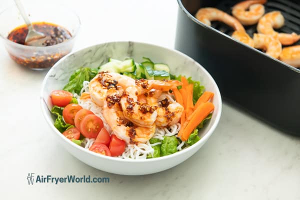 finished bowl of air fryer chili crunch shrimp noodles