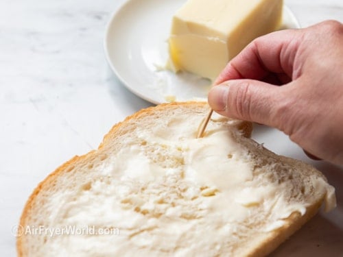 adding toothpicks in bread