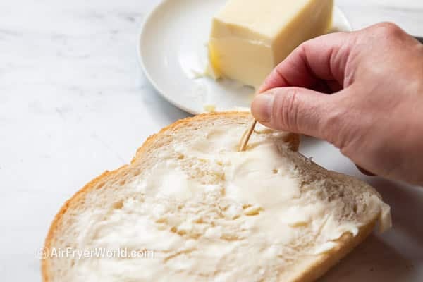 adding toothpicks in bread