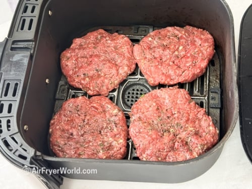 raw lamb patties in air fryer basket