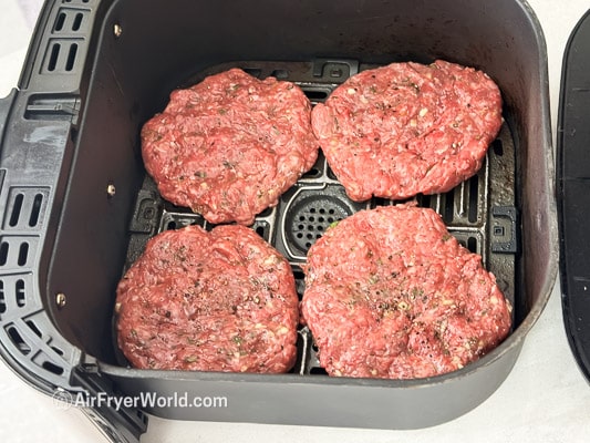 raw lamb patties in air fryer basket