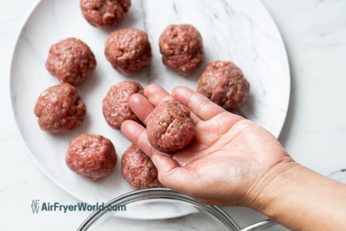 Raw meatball in the hand