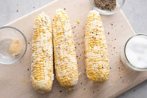 Butter and seasoned corn on the cob
