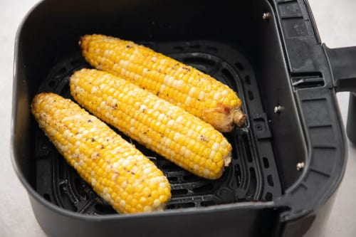 Air fried corn on the cob in air fryer basket