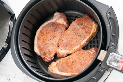 raw pork chops in air fryer basket
