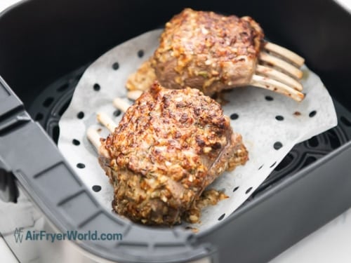 Half cooked crusted lamb rack in air fryer basket