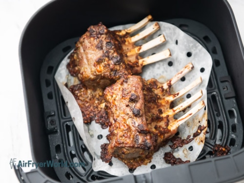 Fully cooked crusted lamb rack in air fryer basket