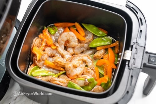 Raw shrimp and veggies in air fryer