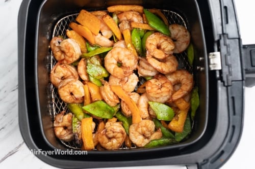 Fully cooked shrimp and veggies in air fryer