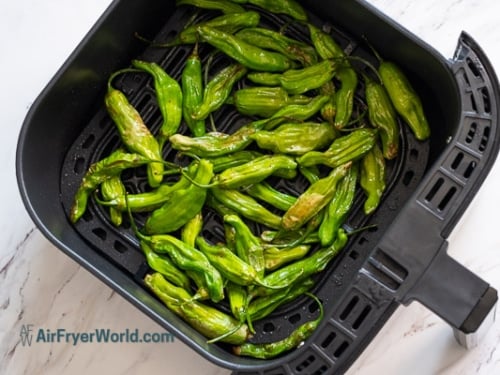 halfway cooked shishito peppers