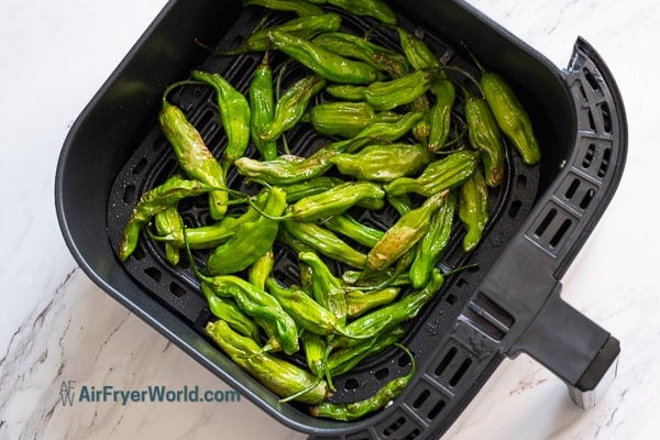 halfway cooked shishito peppers