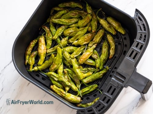 blistered and cooked shishito peppers