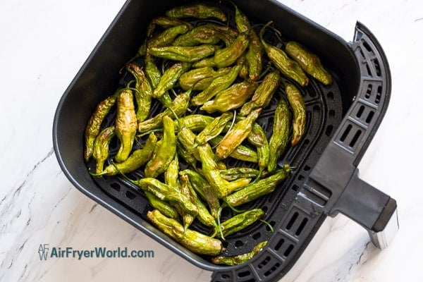 blistered and cooked shishito peppers