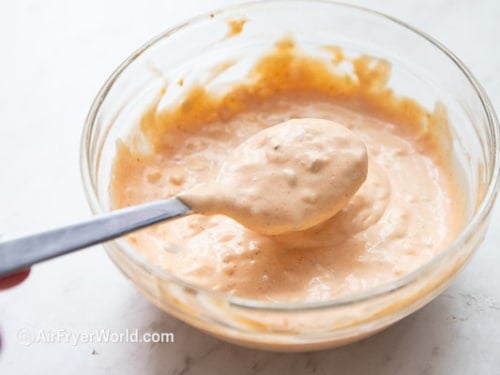 burger sauce with spoon