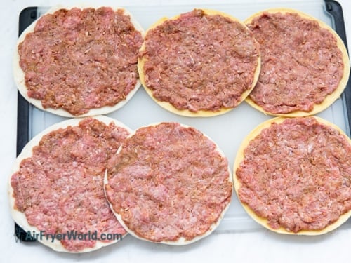 air fryer smash taco meat on tortillas cutting board