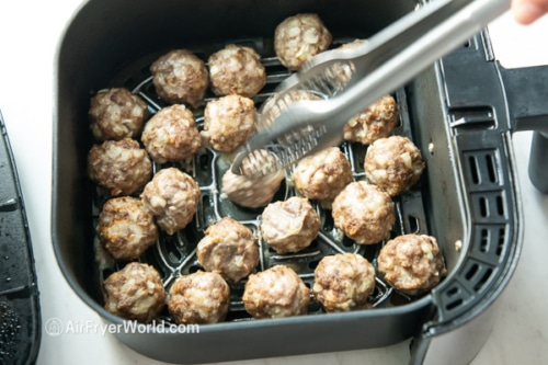 turning half cooked meatballs in air fryer basket