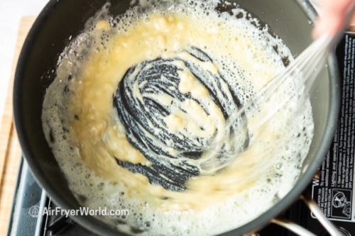 whisking melted butter and flour for gravy