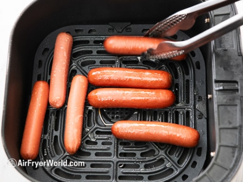 turning hot dogs
