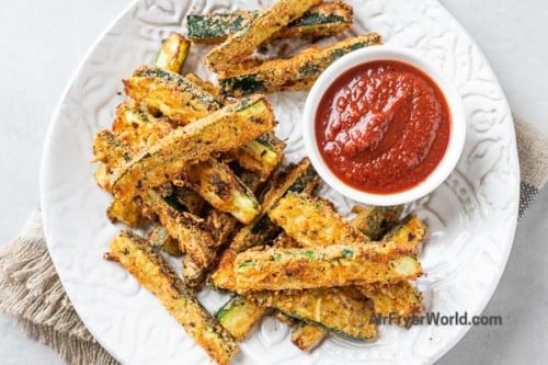 Zucchini fries on a plate with ketchup