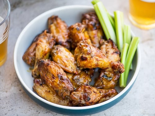 Chicken wings on a plate with celery