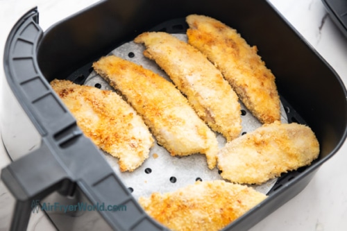 Half cooked fish in air fryer