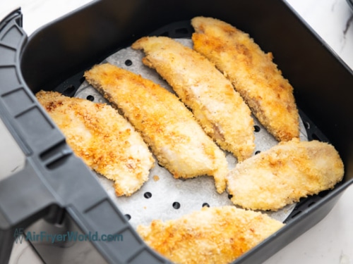 Half cooked fish in air fryer