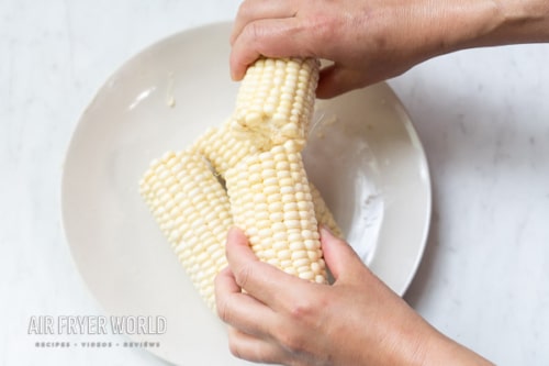 Breaking corn in half