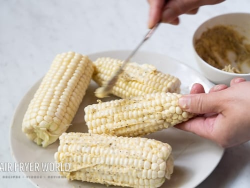 Coating corn with seasoned butter