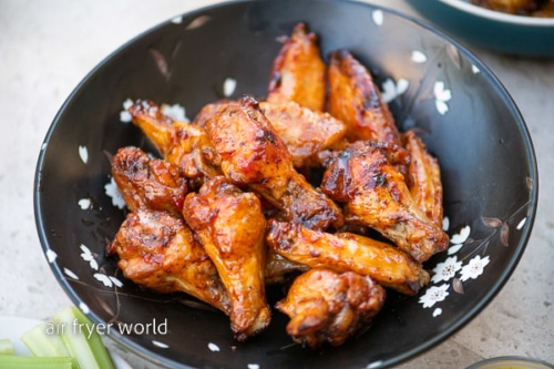 Sauced chicken wings in a bowl