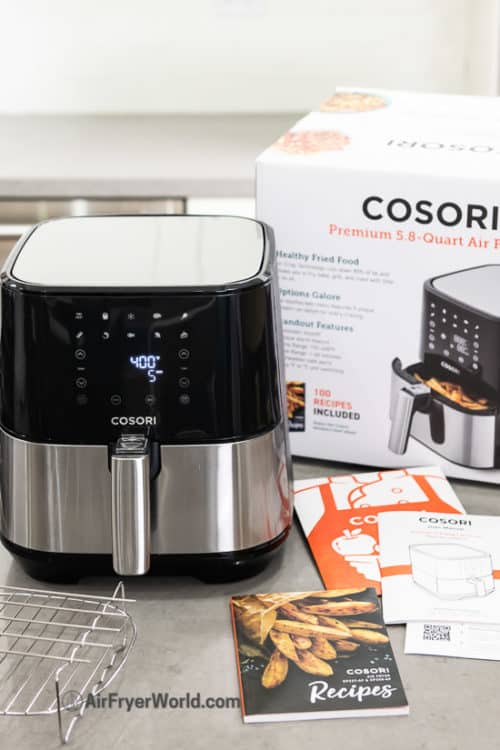 Cosori air fryer on kitchen counter with box